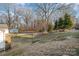 Large backyard with shed and mature trees at 155 Mcadam Ln, Mooresville, NC 28117