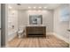 Bathroom with double vanity, shower, and wood-look floors at 155 Mcadam Ln, Mooresville, NC 28117