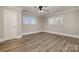 Bedroom with wood-look floors, ceiling fan, and a closet at 155 Mcadam Ln, Mooresville, NC 28117