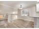 Open dining area with hardwood floors and loft view at 155 Mcadam Ln, Mooresville, NC 28117