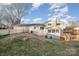 Back of house, detached garage, and fenced yard at 155 Mcadam Ln, Mooresville, NC 28117