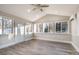 Sunroom with vaulted ceiling, multiple windows, and wood-look floors at 155 Mcadam Ln, Mooresville, NC 28117