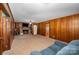 Spacious living room with wood paneled walls and fireplace at 1586 S Oak Dr, Shelby, NC 28150