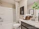 Bathroom with shower/tub combo, gray vanity, and patterned shower curtain at 1980 Copper Path Dr, Fort Mill, SC 29715