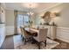 Formal dining room features a large table, chandelier, and decorative mirror at 1980 Copper Path Dr, Fort Mill, SC 29715