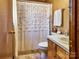 Clean bathroom with a shower and wood vanity at 38899 Dalton Ln, Albemarle, NC 28001