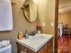 Updated bathroom with vanity, sink and mirror at 38899 Dalton Ln, Albemarle, NC 28001