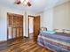 Bedroom with double bed and wood flooring at 38899 Dalton Ln, Albemarle, NC 28001