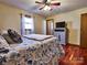 Comfortable bedroom with a queen bed and hardwood floors at 38899 Dalton Ln, Albemarle, NC 28001