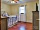 Spacious bedroom with a queen bed and hardwood floors at 38899 Dalton Ln, Albemarle, NC 28001