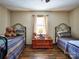 Bedroom with two beds and wood flooring at 38899 Dalton Ln, Albemarle, NC 28001