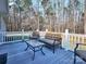 Relaxing deck with outdoor seating and wooded views at 38899 Dalton Ln, Albemarle, NC 28001