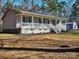 Ranch style home with large porch and detached garage at 38899 Dalton Ln, Albemarle, NC 28001