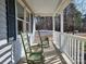 Peaceful front porch with rocking chairs, ideal for relaxing outdoors at 38899 Dalton Ln, Albemarle, NC 28001
