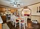 Cozy kitchen features a dining area with a wooden table and chairs, and wood cabinets at 38899 Dalton Ln, Albemarle, NC 28001