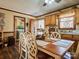 Functional kitchen with ample cabinetry, a dining area, and easy laundry access at 38899 Dalton Ln, Albemarle, NC 28001