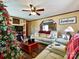 Bright living room with a cozy atmosphere, featuring a Christmas tree and seating area at 38899 Dalton Ln, Albemarle, NC 28001