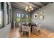 Bright dining area with wood floors and a view to backyard at 5001 Doris Ave, Charlotte, NC 28205