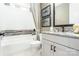 Bathroom with granite countertop, shower/tub combo, and decorative wall at 5089 Valita Rd, York, SC 29745