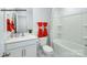 Clean bathroom with white vanity, bathtub, and orange towels at 713 Wagon Cross Ct, York, SC 29745