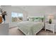 Main bedroom with king-size bed and green striped bedding at 715 Wagon Cross Ct, York, SC 29745