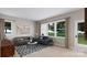 Bright and airy living room featuring a neutral color palette and ample natural light at 8004 Cedarsmith Ct, Charlotte, NC 28217