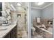 Spa-like bathroom with a soaking tub and a walk-in shower at 837 Park Slope Dr, Charlotte, NC 28209