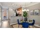 Bright dining area with hardwood floors and modern chandelier at 837 Park Slope Dr, Charlotte, NC 28209