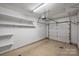 Garage with overhead storage shelving at 837 Park Slope Dr, Charlotte, NC 28209