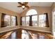 Sunroom with hardwood floors, multiple windows, and brown curtains at 1535 Withers Dr, Denver, NC 28037