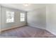 Simple bedroom with carpet and two windows at 3237 Mcharney Dr # 29, Harrisburg, NC 28075