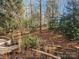 Wooded backyard with stone pathway at 3440 Pickney Bluff St, Fort Mill, SC 29715