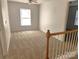 Carpeted bedroom with window and access to upper hallway at 3440 Pickney Bluff St, Fort Mill, SC 29715