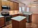 Kitchen with an island, stainless steel appliances, and light wood cabinets at 3440 Pickney Bluff St, Fort Mill, SC 29715