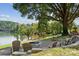 Relaxing fire pit area with lake view and Adirondack chairs at 4339 Reed Creek Dr, Sherrills Ford, NC 28673