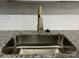 Modern kitchen sink with a gold faucet and granite countertop at 5847 Harris Grove Ln, Charlotte, NC 28212