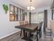 Dining area with a large table and four chairs at 7223 Winery Ln, Charlotte, NC 28227