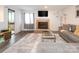 Living room with fireplace and L-shaped sofa at 7223 Winery Ln, Charlotte, NC 28227