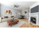 Living room with fireplace, hardwood floors, and staged furniture at 928 Azurine Cir, Fort Mill, SC 29708