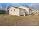 Rear view of a single story house with a large backyard at 99 May St, Gastonia, NC 28052