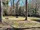 Wooded backyard with a large grassy area at 1364 5Th Street Nw Cir, Hickory, NC 28601