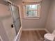 Bathroom with shower/tub and window at 1364 5Th Street Nw Cir, Hickory, NC 28601