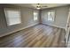 Spacious bedroom with hardwood floors and two windows at 1364 5Th Street Nw Cir, Hickory, NC 28601