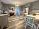 Modern kitchen with gray cabinets, stainless steel appliances, and LVP flooring at 1364 5Th Street Nw Cir, Hickory, NC 28601