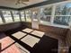 Bright sunroom with brick walls and access to the backyard at 1364 5Th Street Nw Cir, Hickory, NC 28601