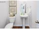 Modern powder room with pedestal sink and decorative accents at 1373 6Th Ne St, Hickory, NC 28601