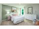 Bright bedroom with a queen-size bed and a large dresser at 1373 6Th Ne St, Hickory, NC 28601