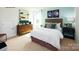 Bedroom featuring a full bed and a dresser with artwork at 1373 6Th Ne St, Hickory, NC 28601