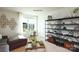 Versatile bonus room features sectional sofa and storage shelving at 1373 6Th Ne St, Hickory, NC 28601