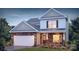Two-story house with stone accents and a two-car garage at 1373 6Th Ne St, Hickory, NC 28601